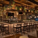 Sotogrande restaurant at Pier Sixty-Six featuring Mediterranean-style décor and vibrant shareable plates in a coastal-inspired setting.