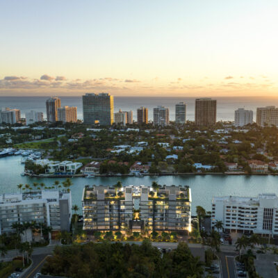Aerial sunset view of Bay Harbor Towers with golden light over Biscayne Bay and Miami skyline