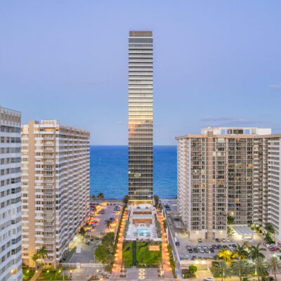 Panoramic terrace view at 2000 Ocean showing Miami skyline to the west and ocean horizon to the east