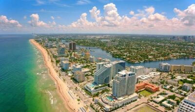 Fort Lauderdale aerial view of beachfront and skyline with turquoise ocean and coastal high-rises.